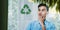 ESG Concepts. Environmental, Social and Corporate Governance. Young Asain Businessman Looking at Recycled Icon on transparent