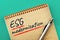 ESG Environmental, Social, and Corporate Governance modernization theme. ESG modernization inscription in an open notepad, on a