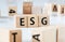 ESG word arranged with wooden letters on a white background