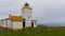 Eshaness lighthouse in Shetland Islands in overcast weather