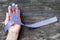 Esophageal cancer awareness Periwinkle color ribbon on human hand with aged wood background