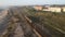 Espinho, Portugal - 12.10.2023: Drone view of a beautiful sandy beach large stones, wooden bridges and paths, railway