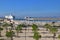 Esplanade Jean Paul II with large cruise ship leaving Marseille Port on waterway between mainland and Quai Jean Charcot