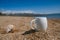 Espresso coffee cup on the issyk-kul beach sand with mountains