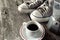 Espresso coffee, espresso maker and dirty sneakers