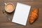 Espresso, croissant and notepads, photo concept, top view