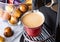 Espresso cup with pods capsules and home coffee machine on white background