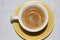 Espresso cup with yellow saucer