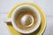 Espresso cup with yellow saucer