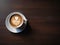 Espresso with Heart Decoration in White Cup on White Plate on Brown Wooden Table