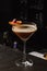 Espresso Martini Cocktail based on coffee, liqueur and vodka. Served with orange chips and raspberry. Space for text