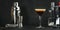 Espresso martini cocktail with vodka, coffee liqueur, syrup and ice, black background, bar tools