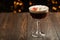 Espresso martinis cocktail garnished with coffee beans.