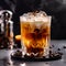 Espresso Tonic close up. Cold invigorating drink with espresso, tonic, chocolate crumb and puffs of smoke on dark background.