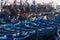 ESSAOUIRA, MOROCCO - SEPTEMBER 29. 2011: Countless blue fishing boats squeezed together in an utterly cramped harbor