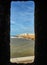 Essaouira Ramparts view through a fortress window in Morocco