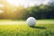 Essence of Golfing on a Dreamy Day with a Ball in the Foreground against a Sunlit Horizon