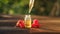 Essence of wild raspberries on table in beautiful glass bottle