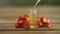 Essence of Wild strawberry on table in beautiful glass jar