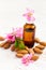 Essential almond oil, almonds and flowers