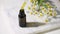 Essential of camomile flowers oil in a dropper glass bottle