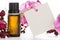 Essential oil, empty tags and roses flowers