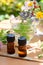 Essential oils with herbal drink and flowers
