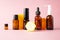 Essential oils, various bottles aromatherapy on a pink background. Aromatherapy and perfumes concept