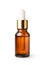 Essential serum oil in amber bottle with gold cap