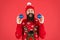 Essential winter activities for families. Hipster bearded man wear winter sweater and hat hold balls red background. New