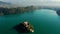 Establishing drone shot of Slovenian Lake Bled with Church on island