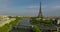 Establishing shot of Paris, France. Aerial drone distant sunset view of Tour Eiffel Tower and Seine River bridge traffic