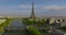 Establishing shot of Paris, France. Aerial drone distant sunset view of Tour Eiffel Tower and Seine River bridge traffic