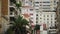 Establishing shot of window in modern European apartment building, cityscape