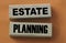 Estate planning words on wooden blocks. Real estate business concept