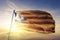 Estelada Catalonia catalan republic state independence movement flag textile cloth fabric waving on the top sunrise mist fog