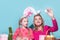 Ester for mother and daughter. Mom with child are preparing for Easter. Mother and daughter wearing bunny ears. Easter