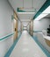 Esthetic and clean modern hospital reception and corridor, private clinic or vet waiting room with empty posters and walls.