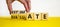 Estimate or evaluate symbol. Businessman turns wooden cubes and changes the word `evaluate` to `estimate`. Beautiful yellow an