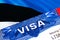 Estonia Visa in passport. USA immigration Visa for Estonia citizens focusing on word VISA. Travel Estonia visa in national