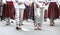 Estonian people in traditional clothing walking the streets of Tallinn