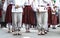 Estonian people in traditional clothing walking the streets of Tallinn