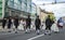 Estonian people in traditional clothing walking the streets of Tallinn