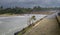 Estuary and the long walking path, lonely mn jogging in the evening