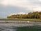 Estuary scene in manningtree with moored boats tide clouds lands