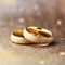 Eternal Sparkle: Close-Up of Wedding Rings and Glitter with Bokeh Background