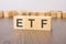 etf text on wooden blocks. wooden background. foreground