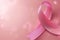 Ethereal pink ribbon with soft bokeh, representing hope and support for breast cancer awareness