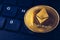 Ethereum cryptocurrency crypto currency. Silver Ethereum coin with gold Ethereum symbol. ETHEREUM ETH cryptocurrency