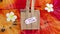 Ethical shopping, small canvas bag made of natural materials with Fair Trade text on price tag on hippie tie dye background and